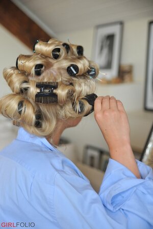 Sexy blonde Kate takes out her curlers while in her bra and underwear