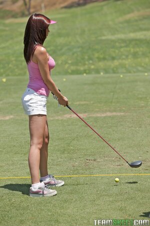 Sexy brunette golfer Carina Roman strips and spreads her small ass