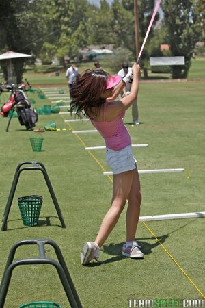 Sexy brunette golfer Carina Roman strips and spreads her small ass