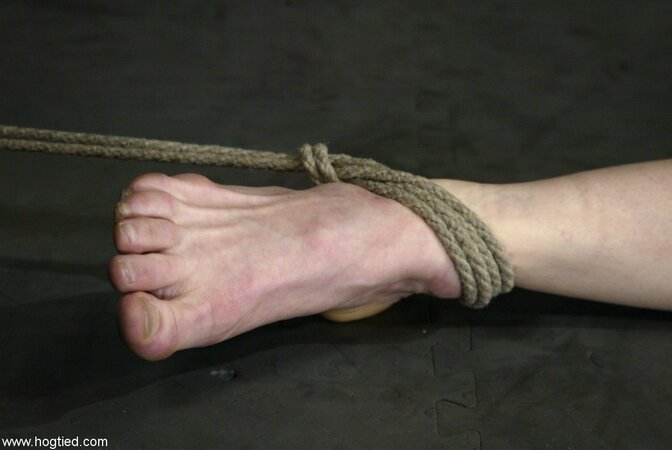 Sye Rena gets whipped and punished with a vibrator in rope bondage