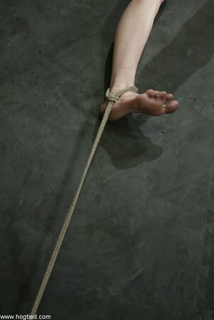 Sye Rena gets whipped and punished with a vibrator in rope bondage