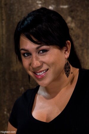 Kayme Kai gets her big tits pulled and toyed while tied to the floor