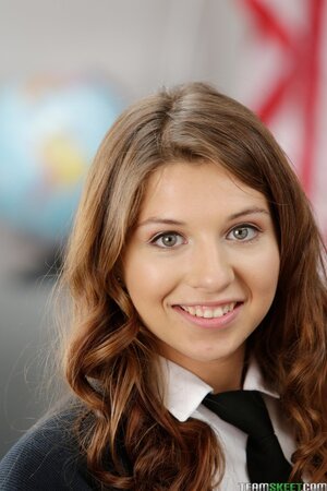 Sweet brunette coed Ariana Grand shows off tits and twat in class in a short skirt