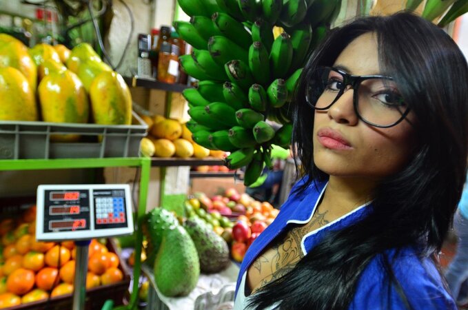 Tattooed Marly Romero licks banana naughty in public