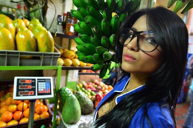 Tattooed Marly Romero licks banana naughty in public