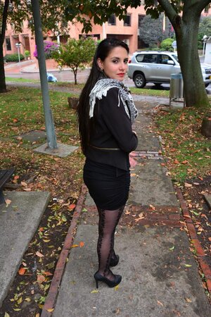 Stylish scarf Latina is going to pose in a cute way in public