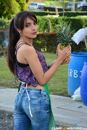 Veronica Marin shows her ass in black lingerie in the field