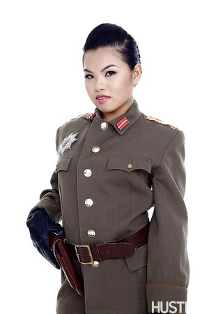 Asian Cindy Starfall poses solo in sexy military garb