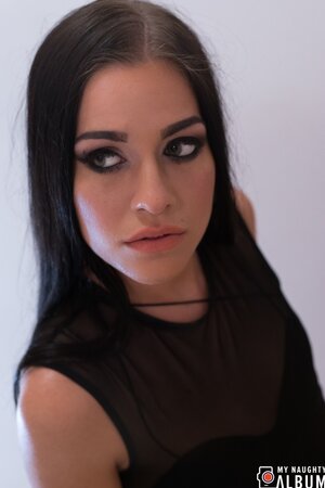 Eveline Dellai is a skinny girl in black who takes hard dick