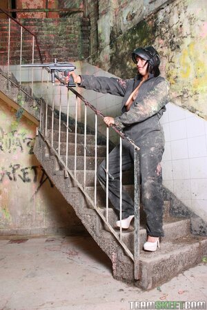Sandra Flores strips to lingerie on paintball field