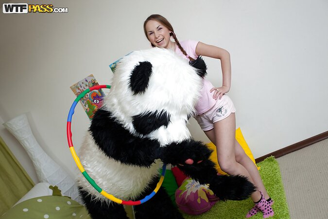 Sweet babe in shorts fun with big panda toy