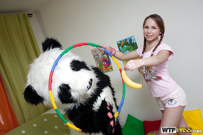 Sweet babe in shorts fun with big panda toy