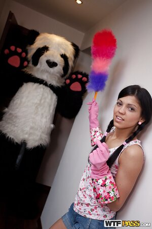 Skinny teen brunette in pigtails strips and plays with her toy