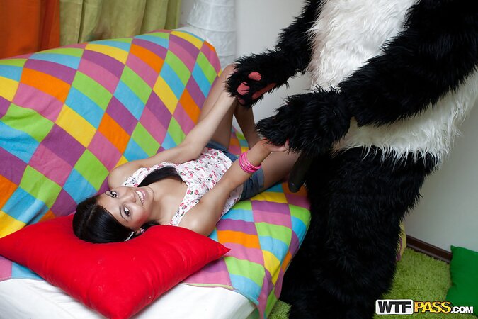 Skinny teen brunette in pigtails strips and plays with her toy