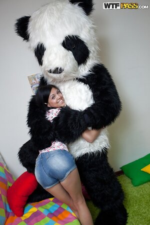 Skinny teen brunette in pigtails strips and plays with her toy