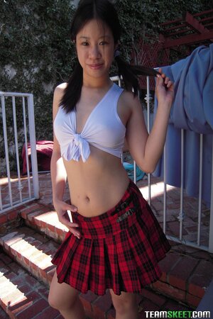 Tiny Asia Zo schoolgirl skirt off for adorable face load