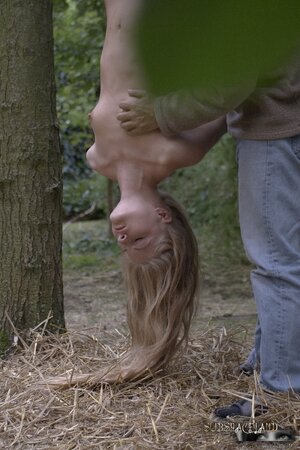 Blonde Hungarian whore Cayenne Klein hung upside down and kissed by man