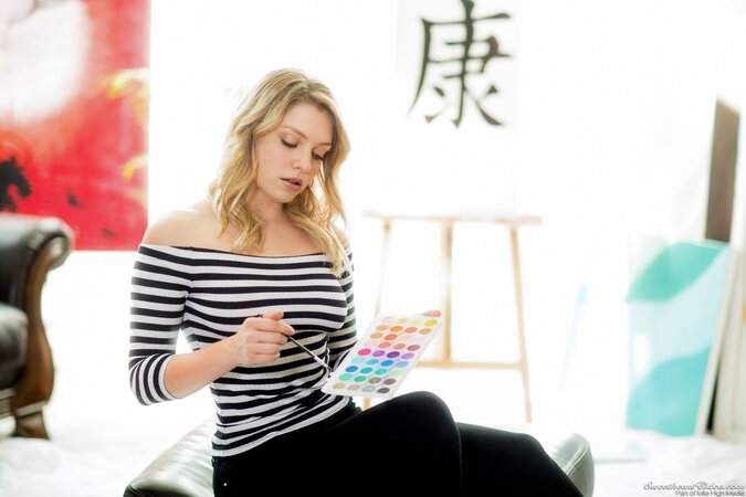 Solo pictures of blonde girl with medium tits and an unusual tattoo on hip