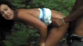 Fine woman is in the forest, showing a horny guy a really good time