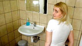 Cute blonde is fucked in the toilet next to a cuckold boyfriend