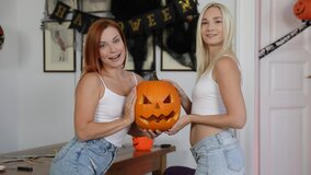 Two juicy girls sharing a hard dick at the Halloween party