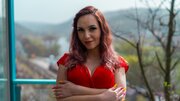 Busty redhead is having sex in hopes of staying in the house