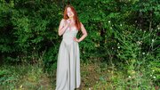 Pale redhead with perfect curves is naked in nature