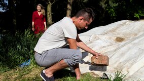 Laura wearing her stockings as a young lad drills her