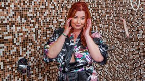 Mature redheaded squirter working the camera and teasing you