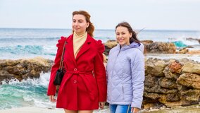 Redhead/brunette lesbian couple ends their date in a bed